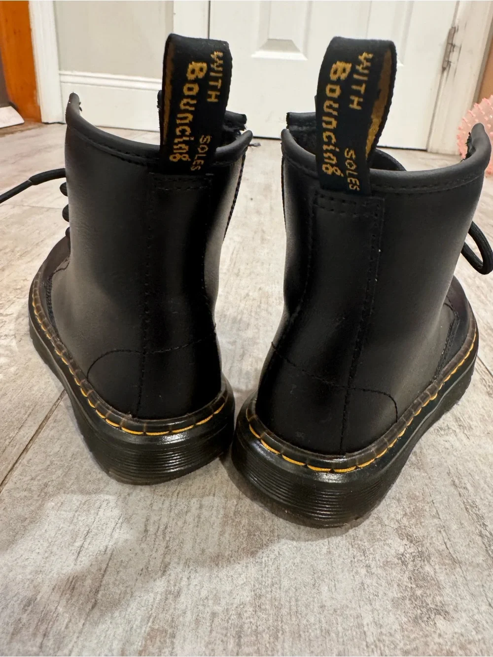 Dr. Martens Black Leather Kids Lace-Up Boots with Yellow Stitching